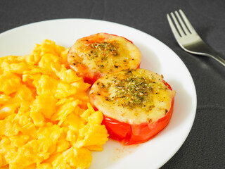 Roasted tomatoes with mozzarella cheese and scrambled eggs