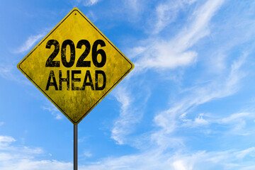 2026 new year. Night road leading to glowing 2026 sign, representing fresh beginnings, innovation, hope, and forward movement, surrounded by streetlights and atmospheric mist