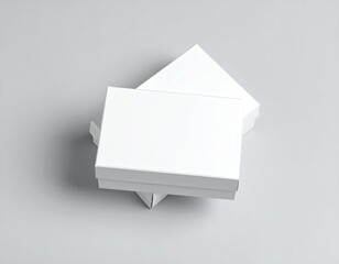 White blank packaging box mockup on gray background, cardboard product box template, minimalist mailer design, ecommerce parcel packaging, clean branding presentation display