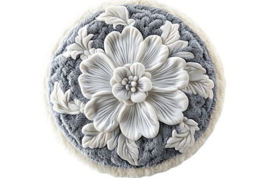 Elegant round plush cushion featuring a large embossed flower design soft gray and cream tones on transparent background