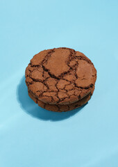 Chocolate brownie cookie on blue background