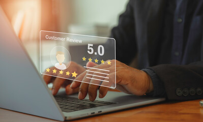 man using laptop to give 5 rating for feedback concept of quality and service experience on online application customer reviews evaluate the quality of product, suggestion satisfaction  good quality.