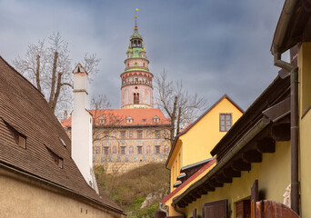 Colorful tower seen from narrow street in Cesky Krumlov, Czech Republic