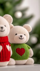Two adorable plush teddy bears in festive sweaters, nestled before a blurred Christmas tree