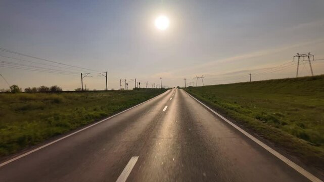 Early morning hyperlapse driving on DN3A to Constanta with low sunrise over highway