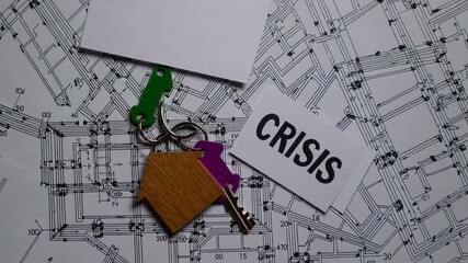 Real estate market challenges symbolized by wooden house keychain and keys resting on architectural blueprints with crisis indicator, representing financial uncertainty - Powered by Adobe