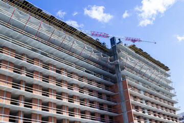 Construction of house made of ceramic bricks and reinforced concrete panels.