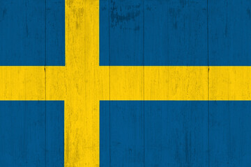 Sweden, swedish flag painted on old wood plank background. Sweden Independence Day June 6th.