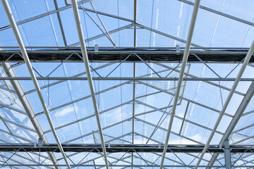 the glass roof top of an automatic green house in Netherlands, flower industry