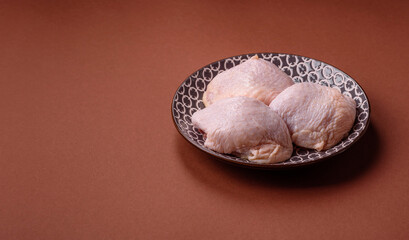 Chicken thigh raw, fresh poultry meat with salt and spices
