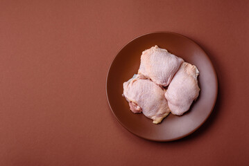 Chicken thigh raw, fresh poultry meat with salt and spices