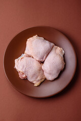 Chicken thigh raw, fresh poultry meat with salt and spices