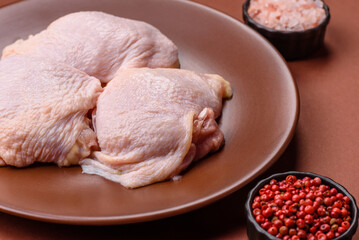 Chicken thigh raw, fresh poultry meat with salt and spices