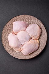Chicken thigh raw, fresh poultry meat with salt and spices