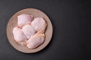 Chicken thigh raw, fresh poultry meat with salt and spices