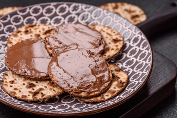 Matzah with chocolate paste for the Jewish holiday of passover