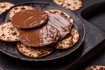 Matzah with chocolate paste for the Jewish holiday of passover