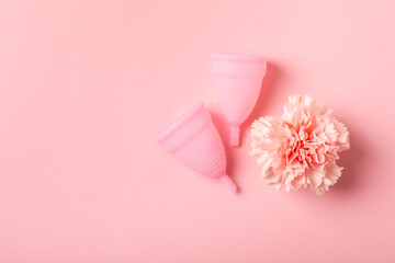 Menstrual cup on a bright background. Sanitary napkins, tampons and menstrual cup.Concept of...