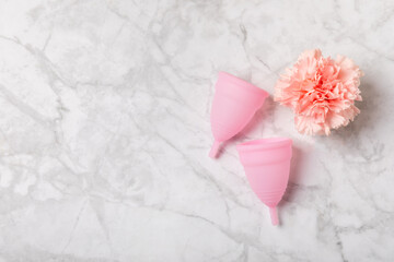 Menstrual cup on a bright background. Sanitary napkins, tampons and menstrual cup.Concept of...