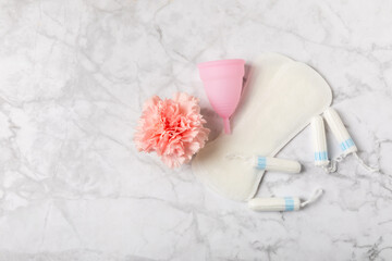 Menstrual cup on a bright background. Sanitary napkins, tampons and menstrual cup.Concept of...