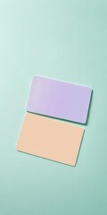Resting on a soft mint surface, a lavender card and a peach card sit side by side, inviting artistic expressions and creative ideas amidst their gentle hues Generative AI