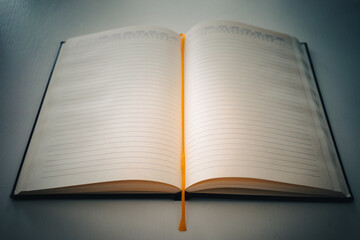 An open notebook on a white table