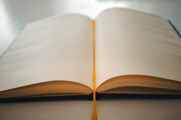 An open notebook on a white table