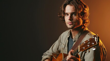 Serious male musician holding guitar, casual clothes, soft studio lighting, artistic portrait composition