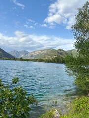 lake and mountains , A large lake in France, with the Alps mountains in the background