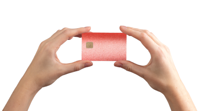 Bank card sale concept. Glossy red plastic card with chip held in hand for credit, debit, cashback,