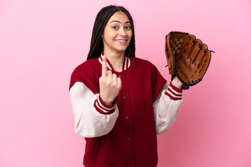 Teenager player with baseball glove isolated on pink background doing coming gesture