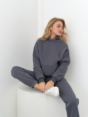 Fashion model exudes elegance in casual studio shoot