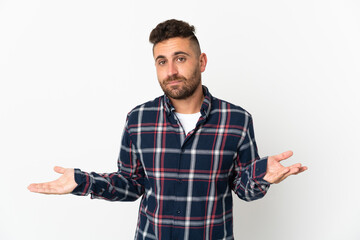 Naklejka premium Caucasian man isolated on white background having doubts