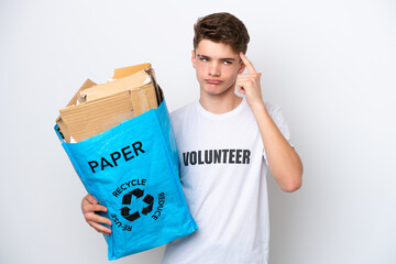 Teenager Russian man holding a recycling bag full of paper to recycle isolated on white background...