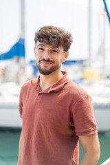 Young Arabian handsome man at outdoors with happy expression
