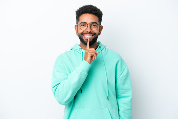 Young Brazilian man isolated on white background showing a sign of silence gesture putting finger...