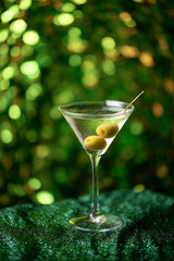 A Dirty Martini on a Sparkly Green Textured Background
