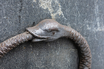 Detailed view of the ancient Ouroboros serpent eating its tail, symbolizing eternity, unity, and...