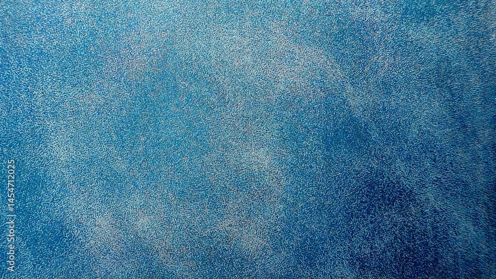 Poster blue speckled abstract texture background for new year design, ideal for web banners, modern print media, branding visuals, and digital backdrops


