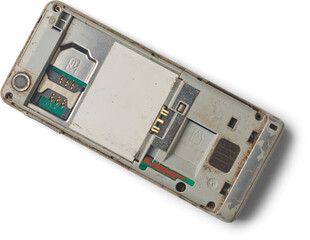 backside of old obsolete mobile phone after removing back cover and battery isolated white background, rear camera, SIM card slot and other contact points visible, taken straight from above