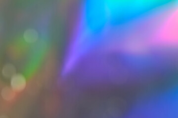 Colorful abstract background with soft rainbow gradients and bokeh effects.