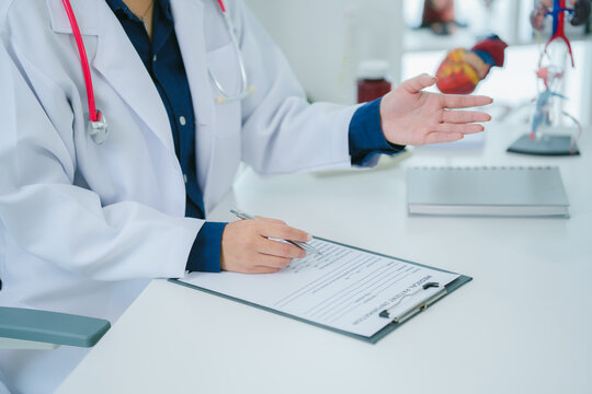 A man is consulting a doctor about hemorrhoids. Squeezing his buttocks. Sees a proctologist to discuss anal problems. Hemorrhoids or treatment concept