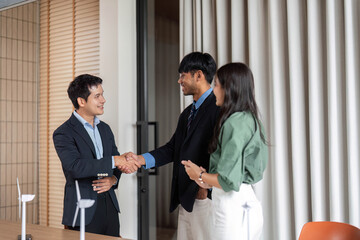 ESG sustainability engagement through teamwork and handshake in office