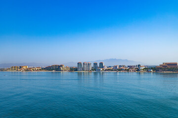 Horizontal view of the Puerto Vallarta, Mexico coastline and hotel row. Beautiful scenic view of this tourist destination.