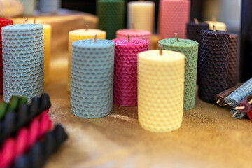 A colorful assortment of handcrafted honeycomb beeswax candles