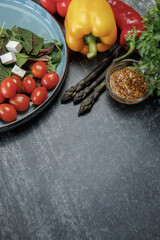 fresh vegetables on the table.Close-up of fresh vegetable salad with bell peppers, asparagus, mustard seeds, healthy eating