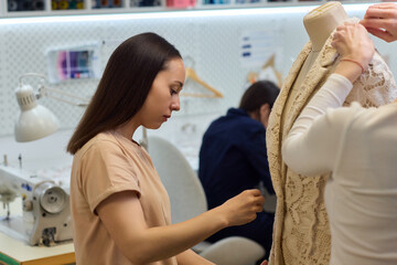 Fashion Design Tailoring a Beautiful Lace Garment on a Dress Form for Perfect Fit