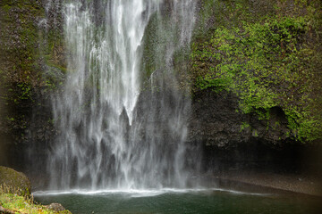 Waterfall Cascades into Calm Pool Below