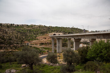 Concrete highway bridge over green valley in Israel