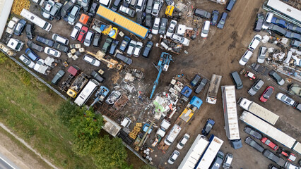 Aerial View of a Crowded Junkyard with Cars and Trucks